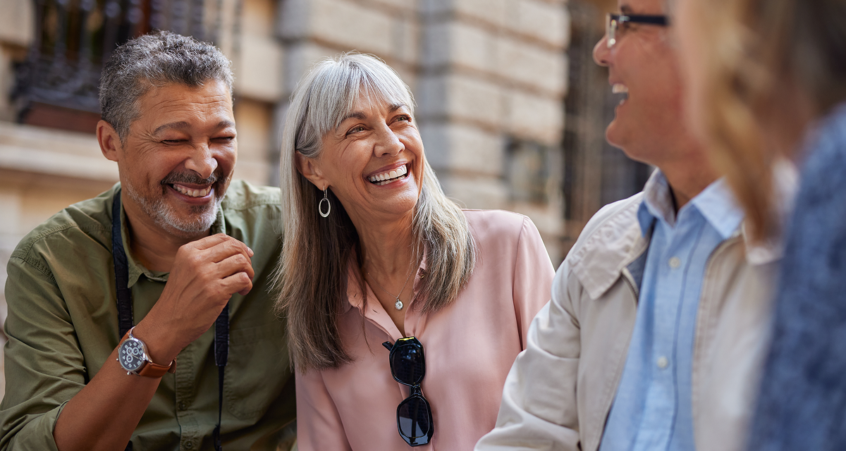 four people laughing
