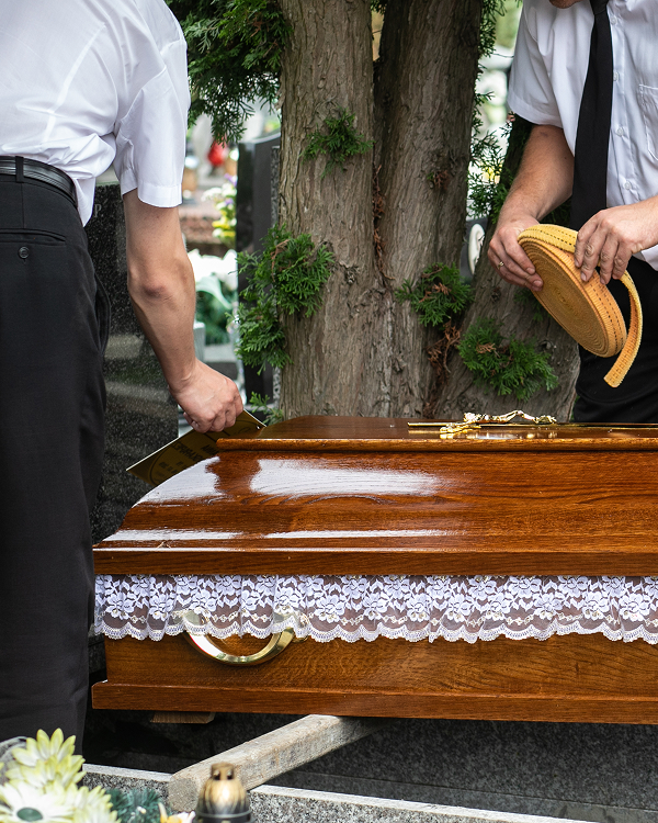 funeral directors with coffin