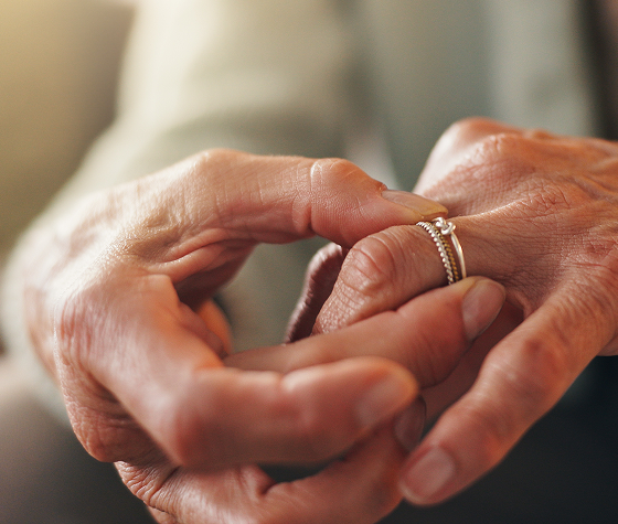 a person taking her ring off